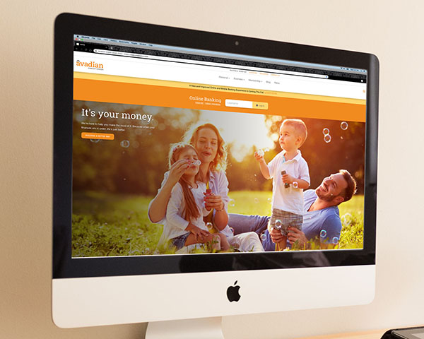 Cropped image from the Avadian Credit Union website, shown on an iMac