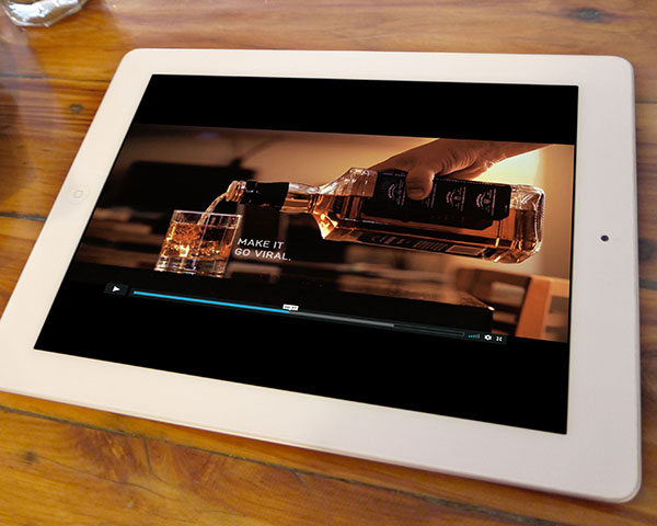 Screenshot from the o2ideas World Cocktail Day video, "Share a Drink With Friends", shown on an iPad;” width=