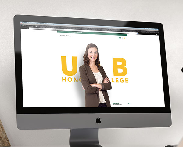 A screenshot from the UAB Honors College website, with a female college student standing against a yellow "UAB", as displayed on an iMac