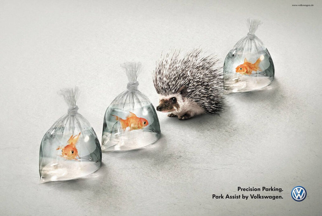 A 2012 Volkswagen ad by agency DDB Tribal Berlin, advertising the car company’s Parking Assist. On a white-gray concrete tabletop sits a row of three goldfish, each in their own clear plastic bag full of water, knotted at the top. But between the second and third fish sits a cute little baby porcupine, cream-colored with a brown pointy muzzle, little brow feet, and a profusion of brown-and-white spines that definitely could have punctured the bags if the porcupette (that’s really what they’re called — porcupettes) hadn’t parked so precisely. In the lower right-hand corner are the Volkswagen logo and the words “Precision parking. Park Assist by Volkswagen.”