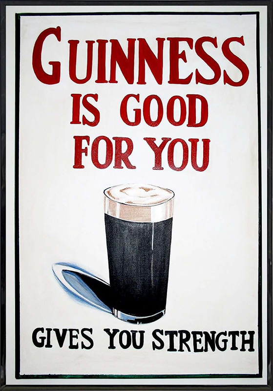An old bar poster, on a white background with a black frame around the edges. It shows a glass of Guinness Stout beer, a dark beer with a white, foamy head. Above the glass, in large red type, are the words, “Guinness Is Good for You.” And below it, in black type, are the words, “Gives You Strength.”