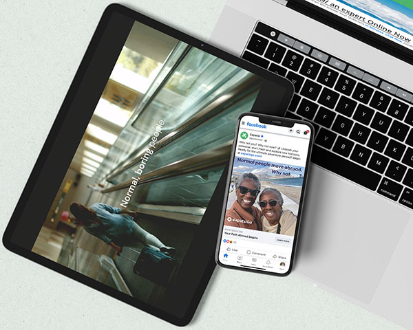Images of an airport scene on a tablet and an ad with two smiling women on an phone, both resting on the keyboard of an open MacBook 